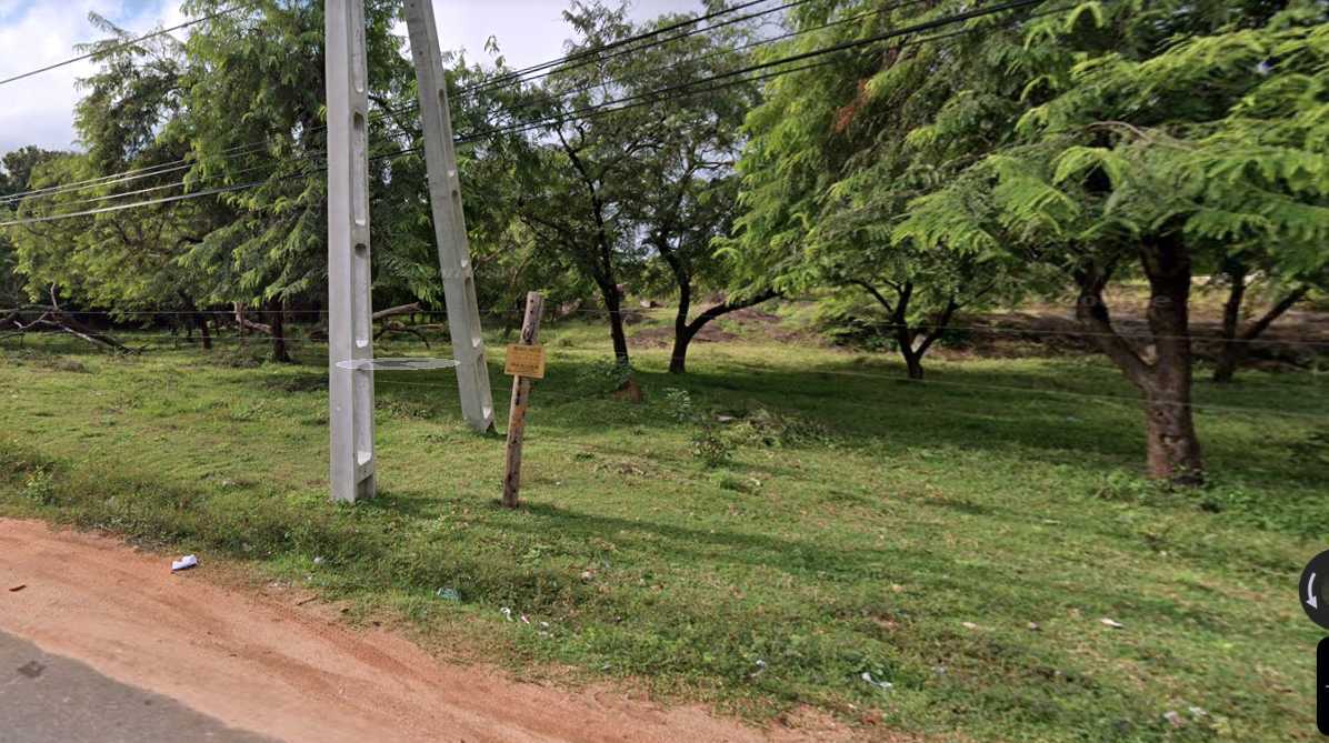 The electric fence separating the ruins of Vishnu Devalaya Mo 3 from the main road